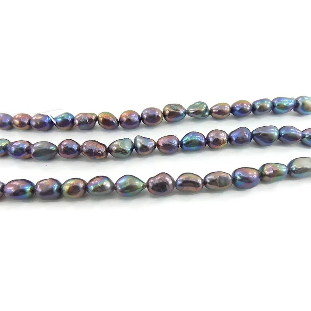 1 FILO PERLE SCARAMAZZE IRREGOLARI COLORE GRIGIO CANGIANTE 10X7 MM.