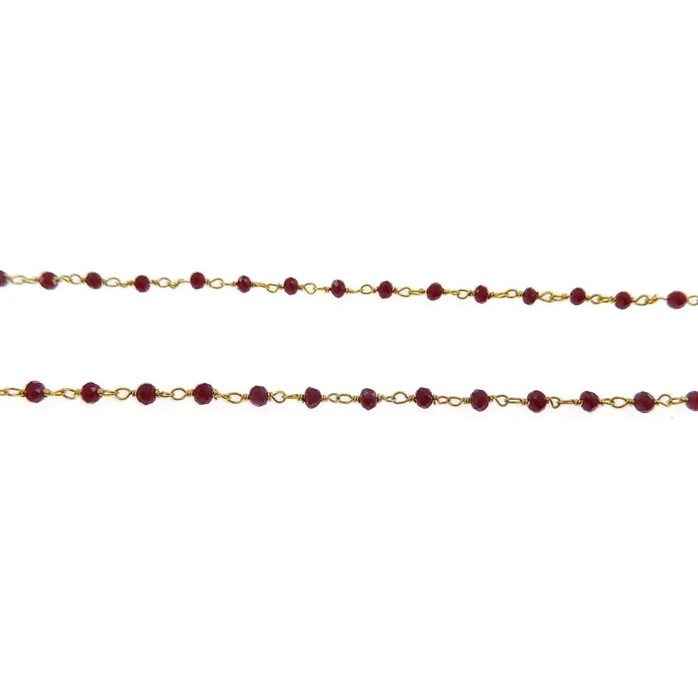 50 cm. di  Catena rosario tono dorato con cristalli rosso rubino di 3,5x2,5 mm