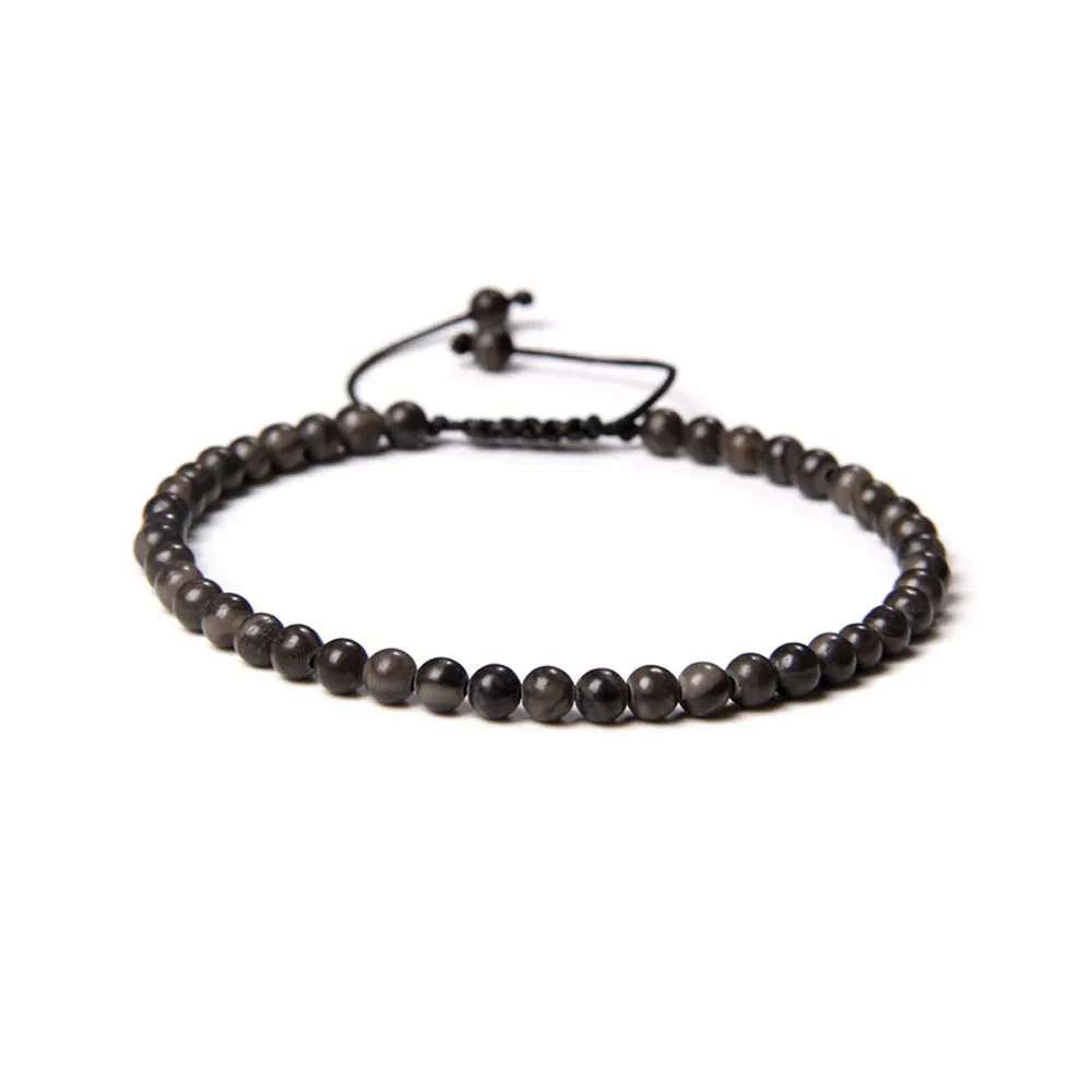 Bracciale in Legno Fossile – cordino regolabile con pietre di perline